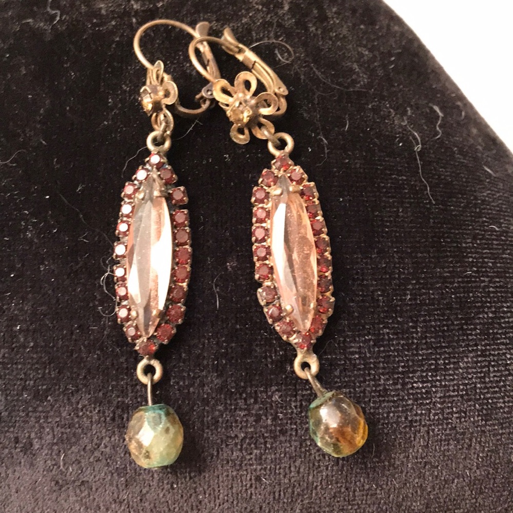 Earrings surrounded by small garnets old
